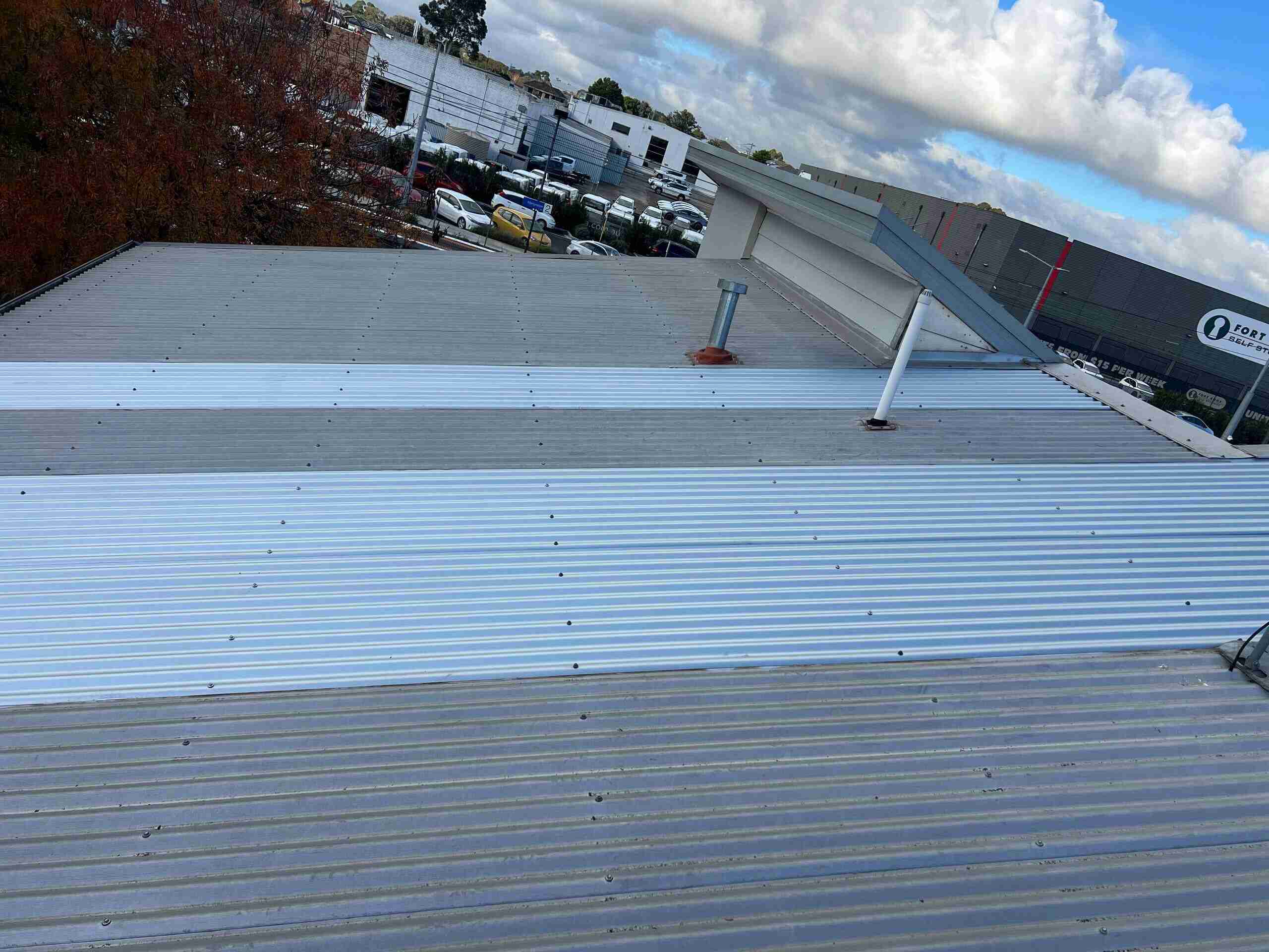 Completed dry pan flashing installation showing watertight tile-to-wall junction